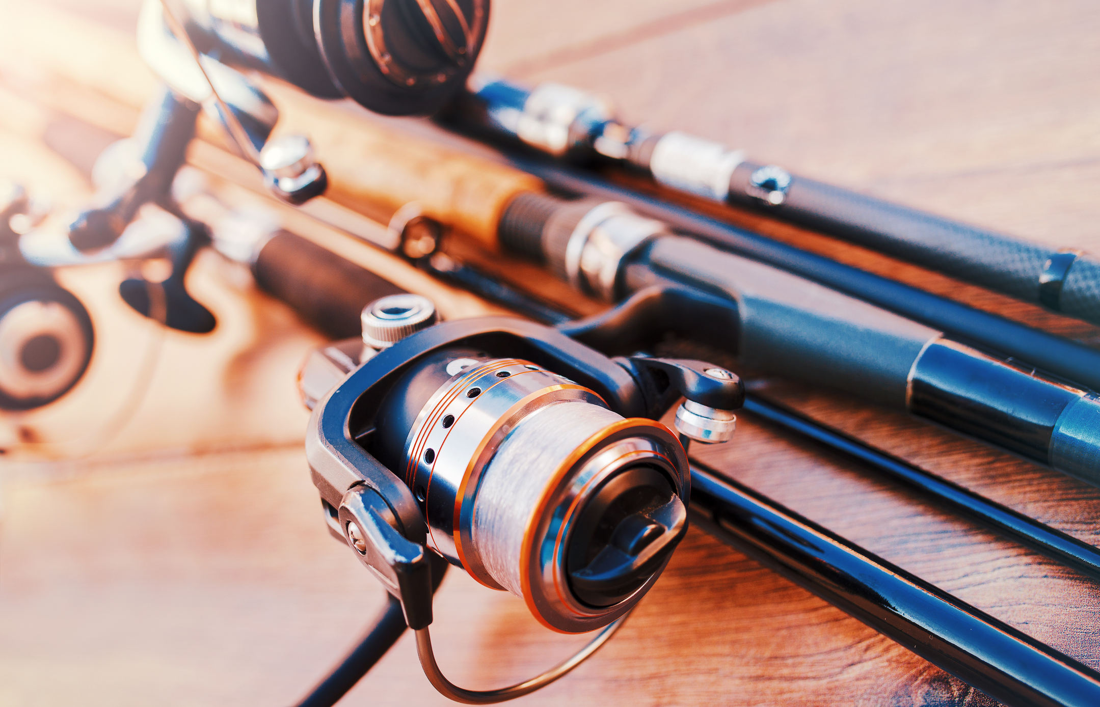 Fishing equipment on a old wooden table.